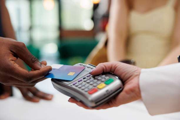 istock Man making payments at hotel lobby 1599052526