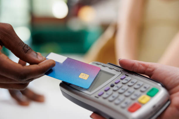 istock Tourist paying on pos at hotel reception 1599056371