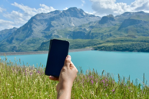 POV smartphone on beautiful nature scenario