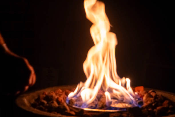 istock Gass fire place with stones and flames abstract background camping 1599123552