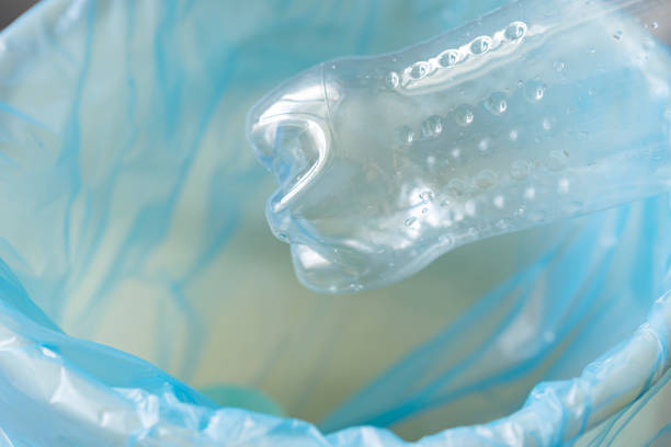 istock Plastic Bottle Being Disposed of in Trash Can 1599128629
