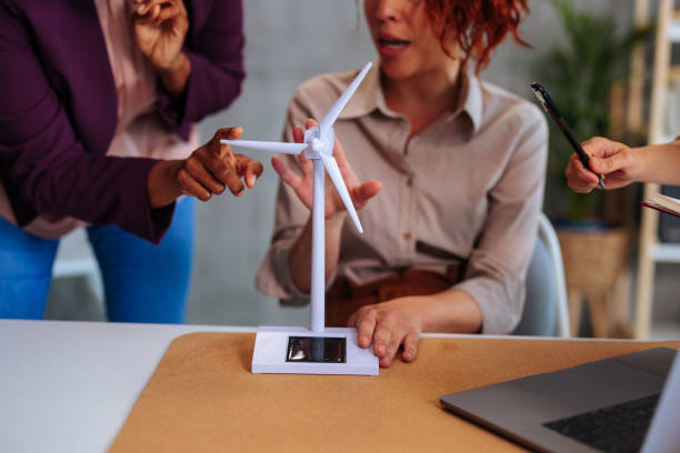 istock Close up photo of prototype propeller while female engineers discussing about it. 1599131299