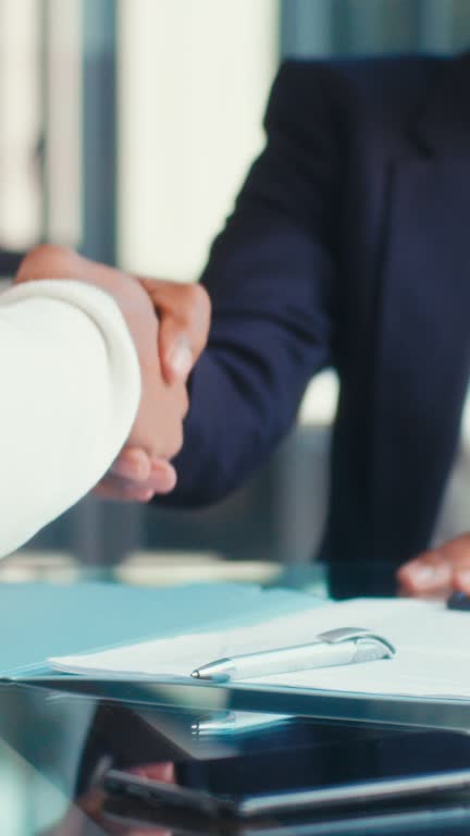 Handshake, contract and signature of a black man for business deal, partnership or agreement. HR person and portrait of businessman in corporate office shaking hands for success, hiring or interview