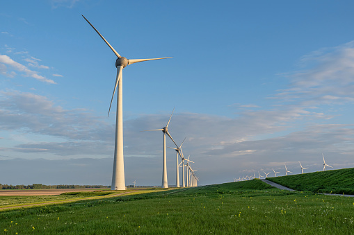 row of onshore wind turbines