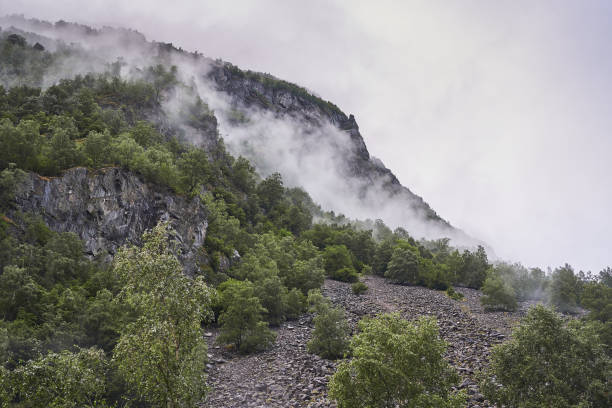 istock Mountains in Norway with clouds and fogg. 1599137828
