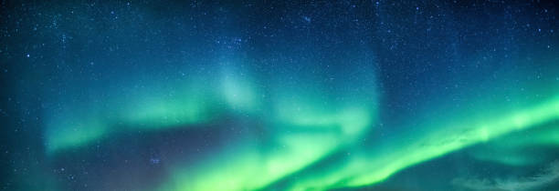 istock Aurora borealis or northern lights with starry glowing in the night sky 1599142901