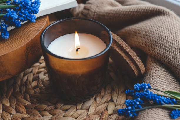 istock Candle and flowers in home atmospheric interior 1599157734