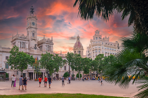 Plaza del Ayuntamiento in Valencia historic old town district during sunset Spain
