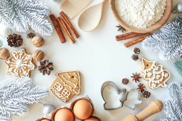 istock Bakery background with ingredients for cooking Christmas baking. Flour, eggs, cinnamon and gingerbread on the table top view 1599207111