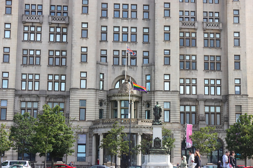 The Cunard Building on the Liverpool waterfront, as seen from the Pier Head, the LGBT flag can be seen on display at the entrance