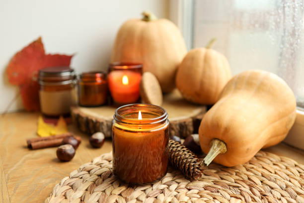 istock Thanksgiving autumn decor, burning candle, pumpkins and candles 1599217257