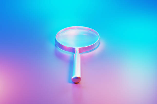 istock Metallic Magnifier Illuminated By Blue And Pink Lights On Blue And Pink Background 1599220888