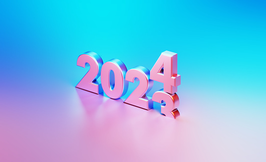 Metallic 2023 changing to 2024 illuminated by blue and pink lights on blue and pink background. Horizontal composition with copy space.