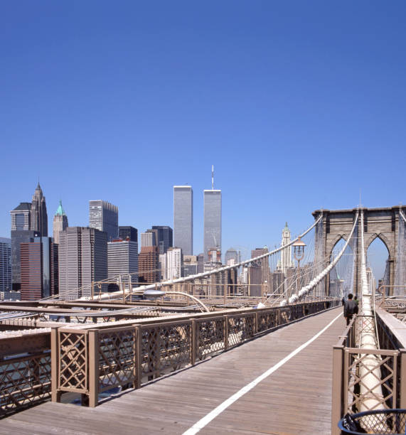 Sunny morning at the Brooklyn Bridge Sunny morning at the Brooklyn Bridge looking into Manhattan with the Twin Towers, NY, USA twin towers manhattan stock pictures, royalty-free photos & images