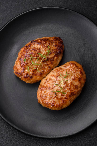 istock Delicious fresh fried minced fish cutlets with spices and herbs 1599274123