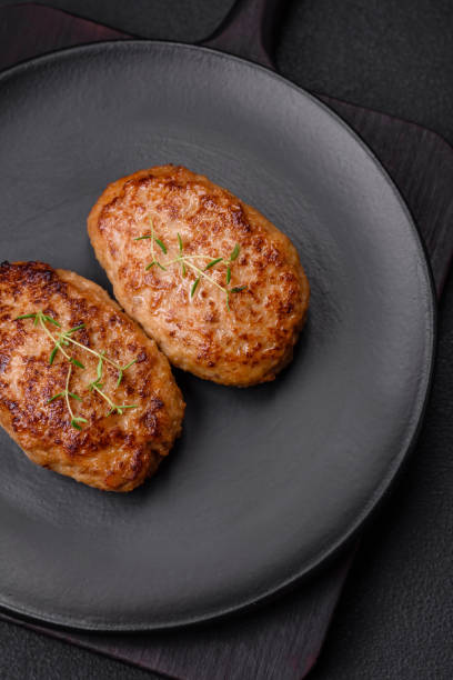 istock Delicious fresh fried minced fish cutlets with spices and herbs 1599274135