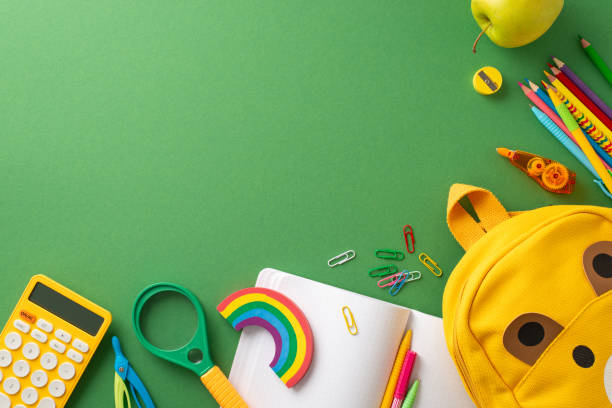 istock Back-to-school creativity: A captivating top-view photo featuring a green board adorned with an array of vibrant school supplies and backpack. Copy-space provided for text or promotional content. 1599287298