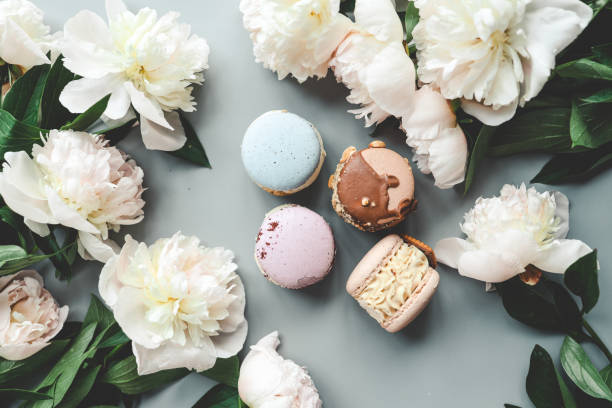 istock Macaroons and peonies, flat lay top view 1599302714