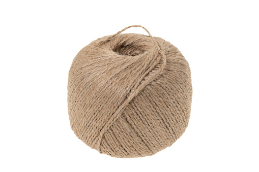 A new ball of string or jute twine on a white background