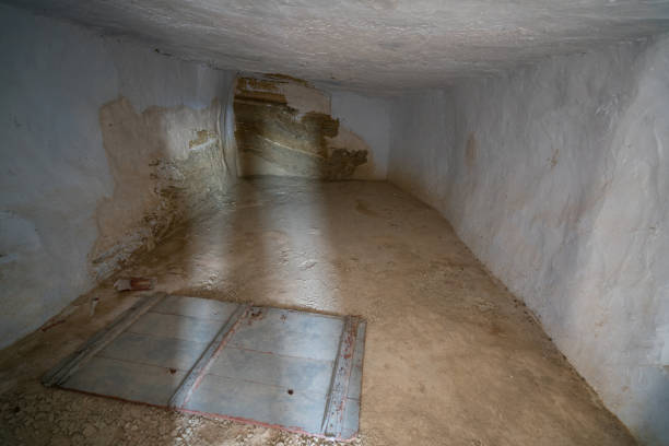 Argueda caves abandoned interior room with white walls, in Spain