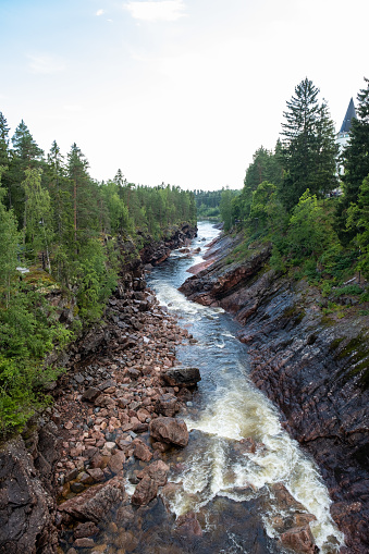 A stormy stream of water along the old bed of the Vuoksa river in Imatra Finland.