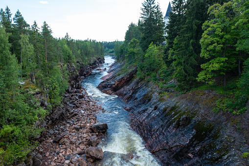 A stormy stream of water along the old bed of the Vuoksa river in Imatra Finland.