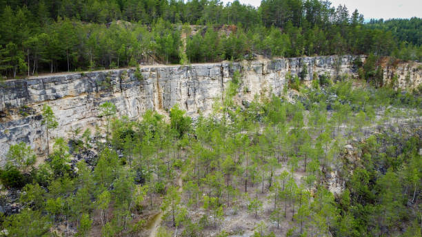 istock Rock climbing in a limestone quarry 1599528547