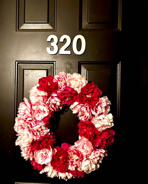 istock Pink and Red Wreath on Apartment Door 1599608277