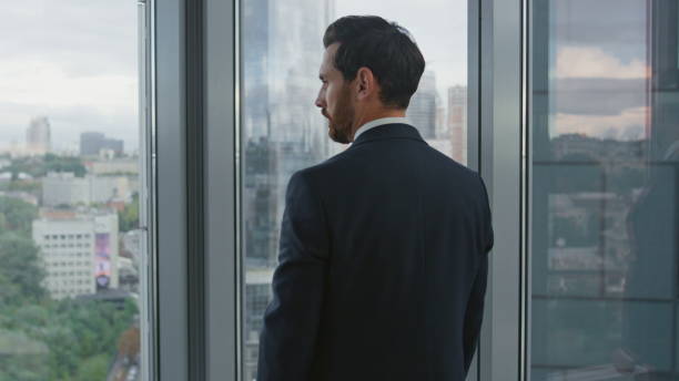 istock Thoughtful worker creating business strategy near office window close up. 1599694619