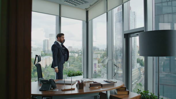 istock Worried manager walking office trying to solve corporate financial problems. 1599703557