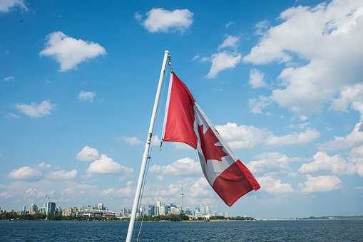Canada Flag with Toronto, Ontario in the Background