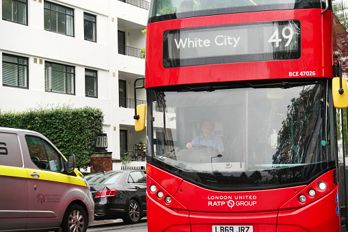 Glasgow, Scotland - July 13, 2022:  Glasgow city bus is taking the right lane in front of the Modern Art Gallery.