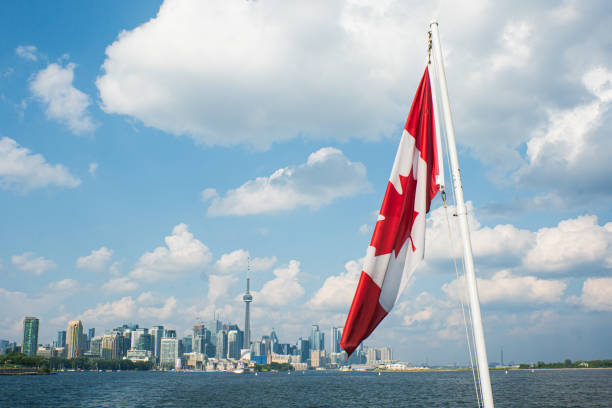 istock Canada Flag with Toronto, Ontario in the Background 1599712394