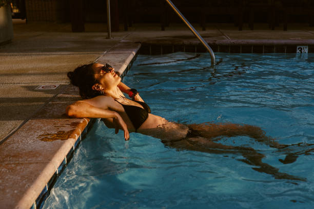 istock woman relaxing in the pool 1599719279
