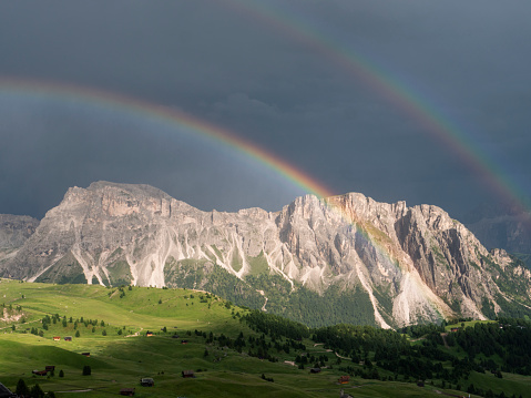 Double rainbow over Dolomites landscape around Seceda, Monte pic, Santa Christina mountains,Italy.