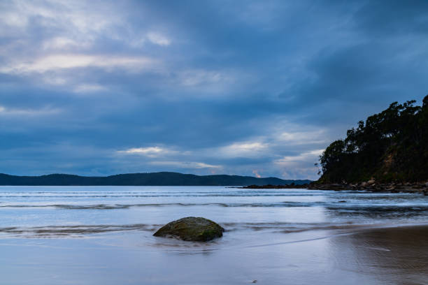 istock Rainy day sunrise at the beach 1599768215
