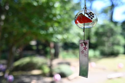 Japanese Wind Bell with Mt Fuji hanging from the eaves of an old Japanese house