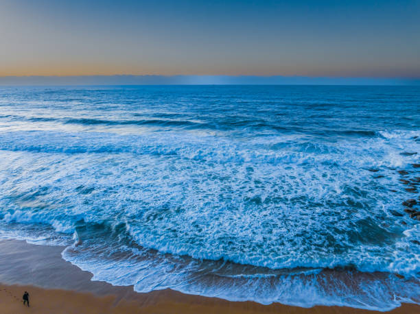 istock Sunrise and waves at the seaside 1599790749