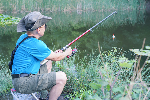 Close up view of a man fishing in the river.