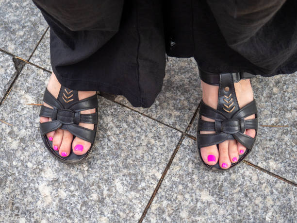 istock Nails with and without pedicure. Contrast. 1599958350