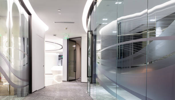 istock Curved corridor with glass partitions in modern building 1599986368