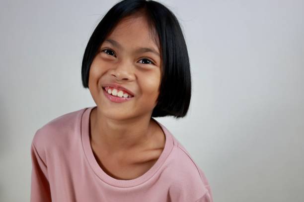 istock Portrait of child on a grey wall background 1599994822