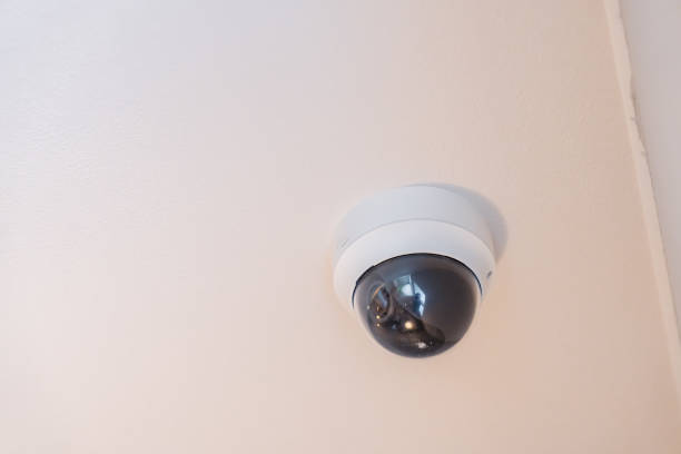 istock Security camera mounted on the ceiling of a house 1600024208