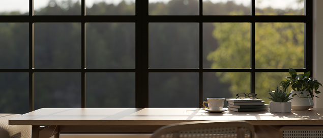 Copy space for product display on a wooden table against the window in a comfortable room. workspace, study table, office desk. 3d render, 3d illustration