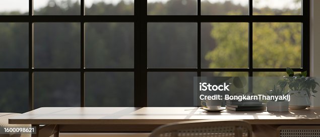 istock Copy space on a wooden table against the window in a comfortable room. 1600098621