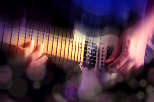 Close up man playing electric guitar