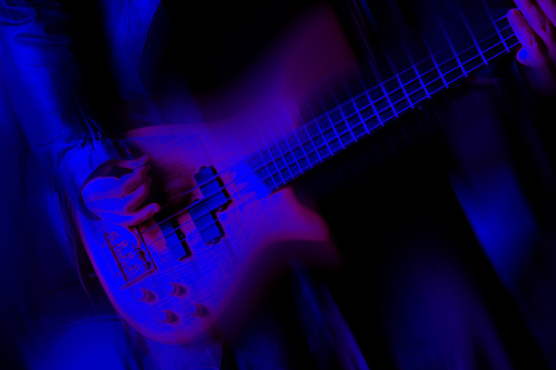 Close up man playing electric guitar