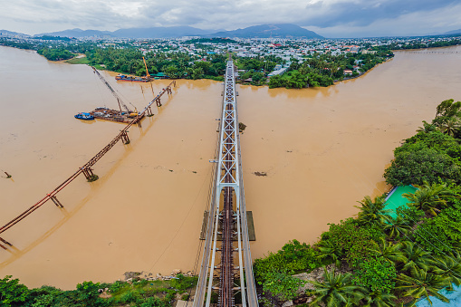 Aerial view of railway bridge over the river.