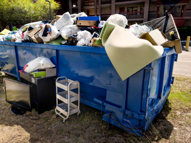 istock Dumpster full of garbages at residential garbage dump area 1600121697