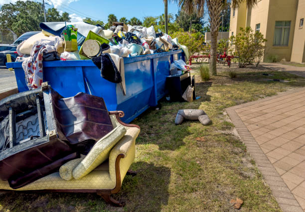 istock Dumpster full of garbages at residential garbage dump area 1600121698